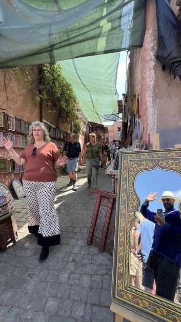 Licensed local guide Brahim Abouamou leading a walking tour through the colorful Medina of Marrakech
