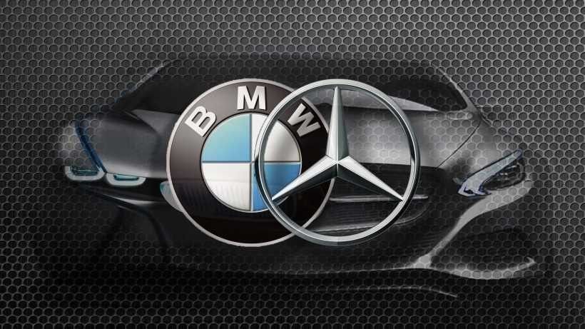 Un logo BMW et Mercedes sur fond noir.
