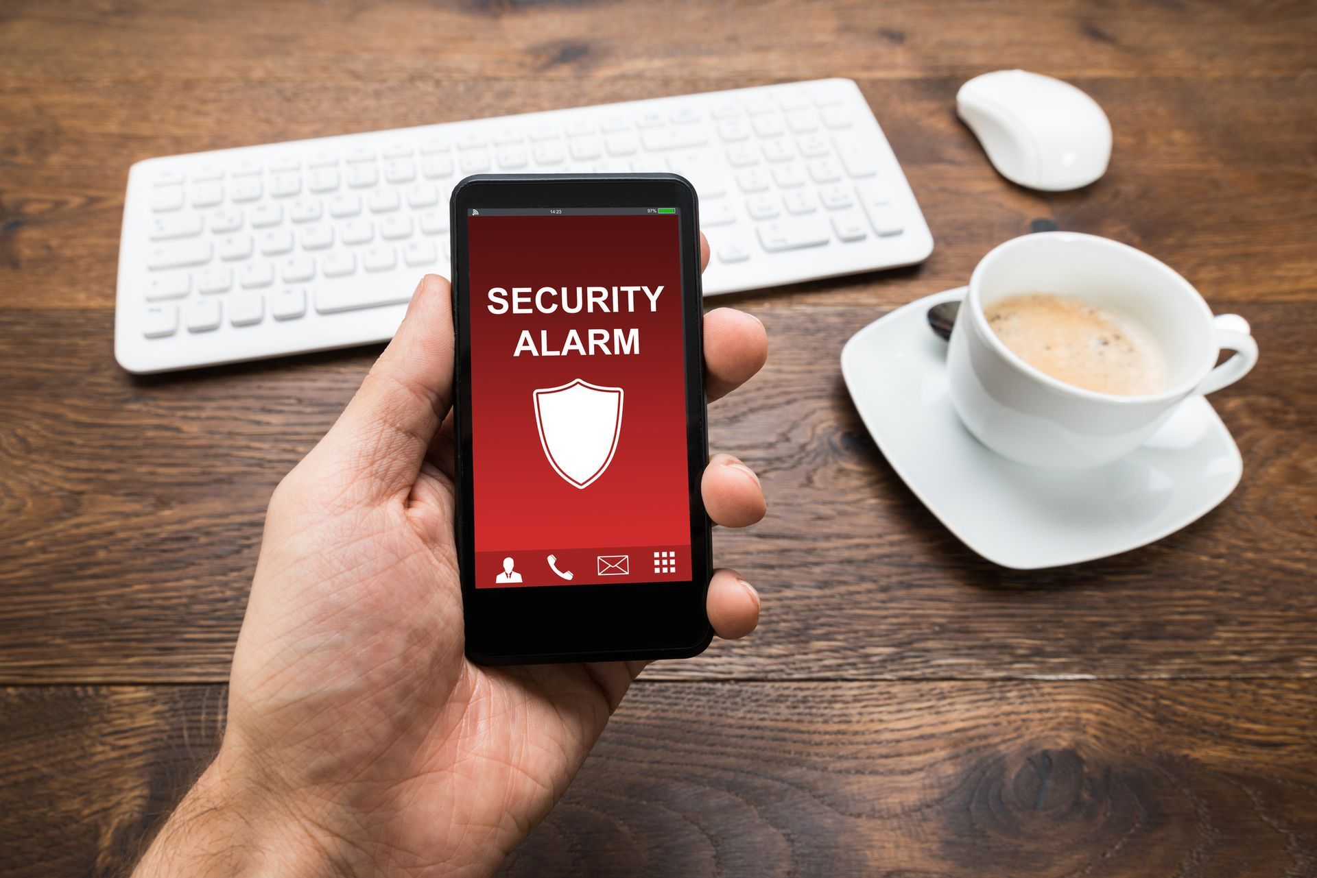 Hand holding a phone displaying a 