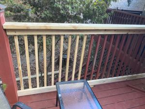 A wooden deck with a table and chairs on it