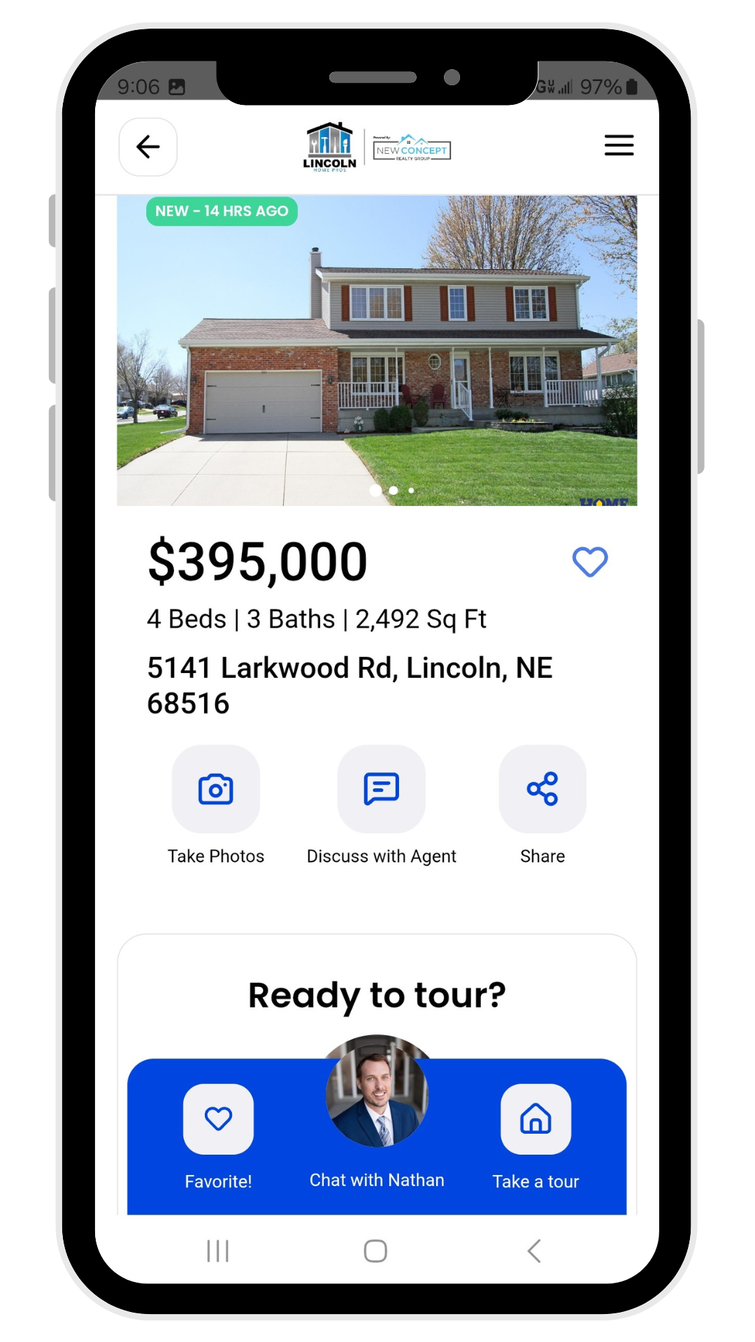 A cell phone with a picture of a house on the screen.