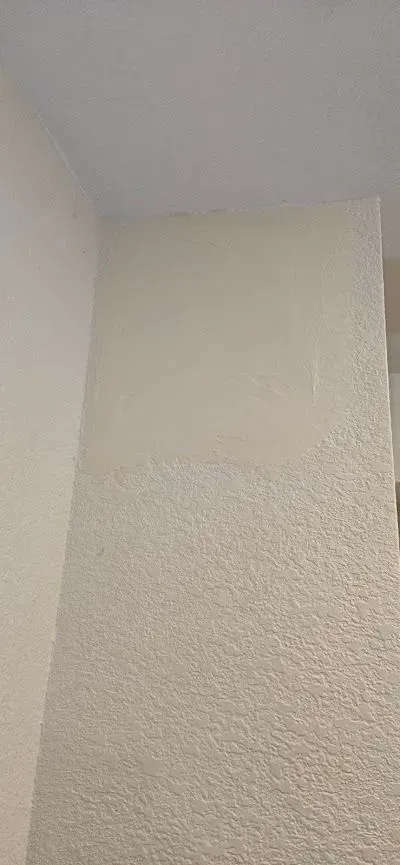 A room with white walls and a white ceiling.