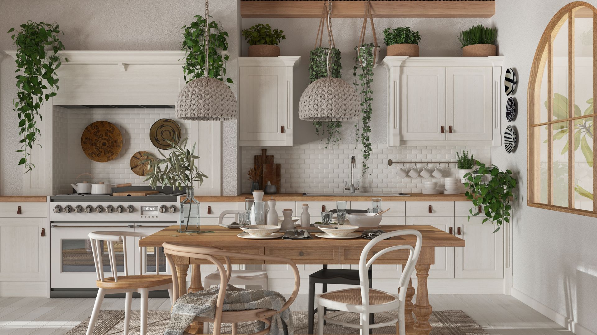 A kitchen with white cabinets , a wooden table and chairs.