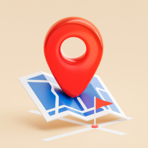 A 3D red map pin icon sitting on top of a blue and white folded paper map against a light beige background.