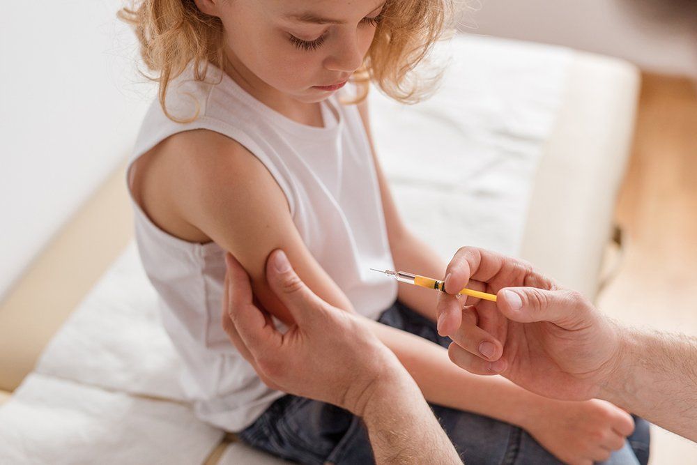 Doctor Injecting a Shot of Vaccine to a Patient — Memphis, TN — Vaccine Injury Lawyers