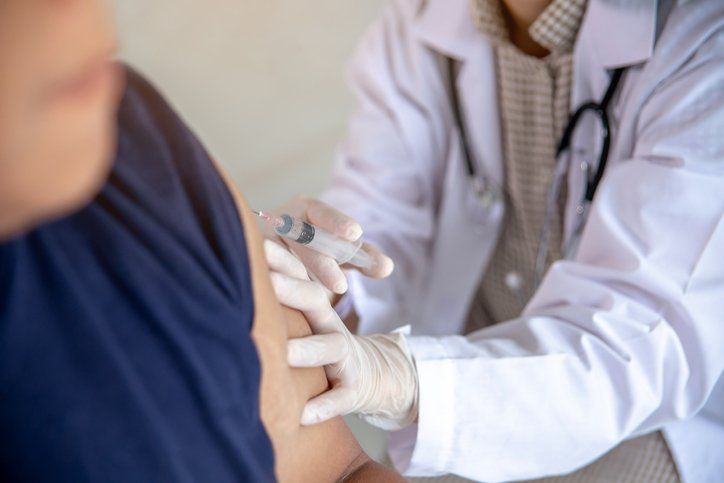 Man Receiving Flu Shot — Memphis, TN — Vaccine Injury Lawyers
