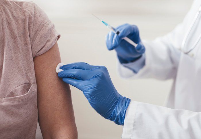 Doctor Injecting Vaccine to Man — Vaccine Injury Lawyers — Memphis, TN