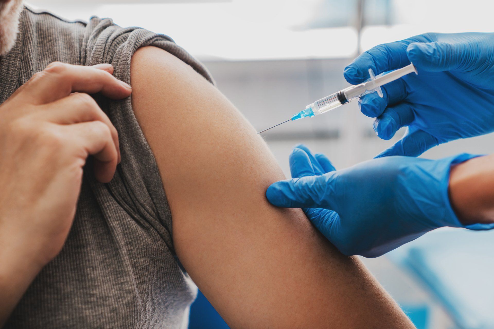Hands with Gloves Injecting a Vaccine — Memphis, TN — Vaccine Injury Lawyers