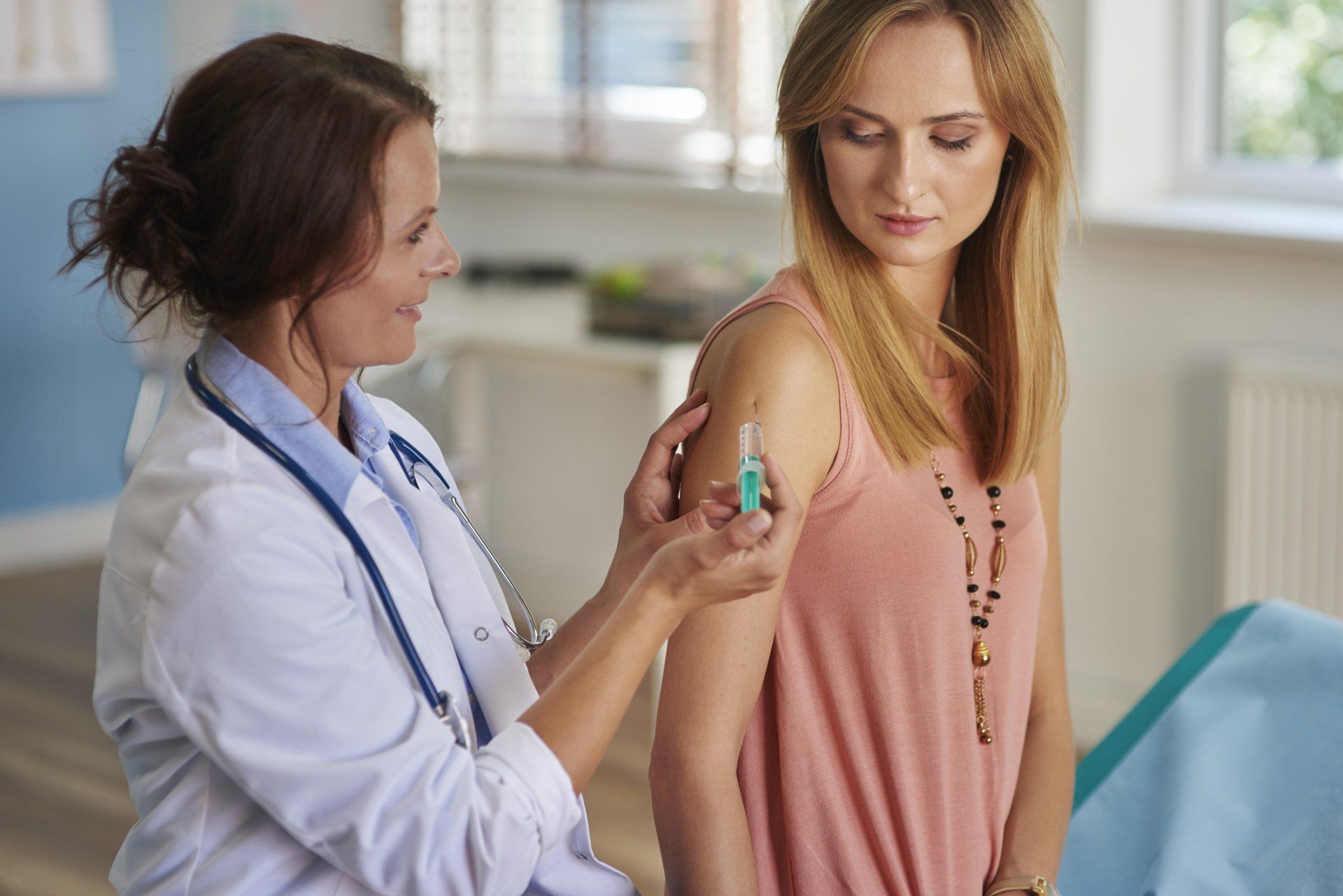 Giving Vaccine to A Woman — Memphis, TN — Vaccine Injury Lawyers