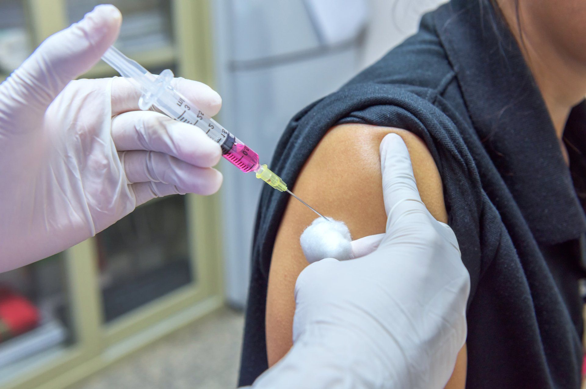 Doctor Vaccinating A Woman — Memphis, TN — Vaccine Injury Lawyers