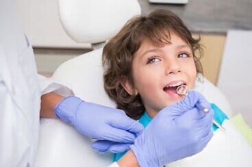 Child receiving dental exam - Dentist in Omaha, NE