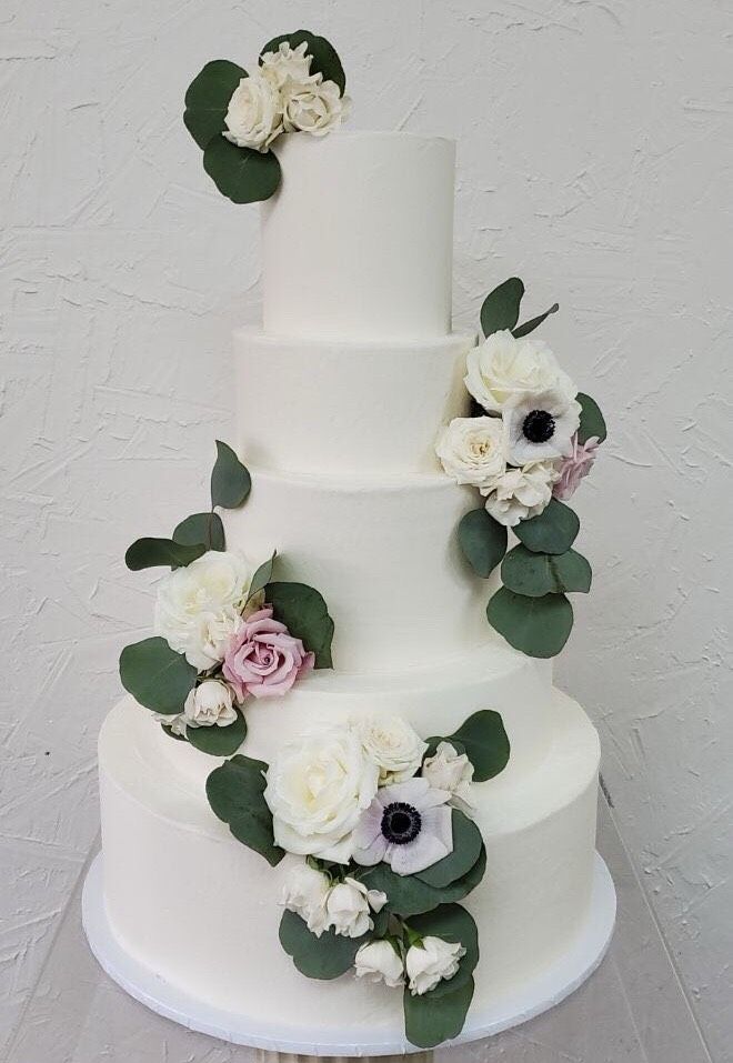 a wedding cake with flowers