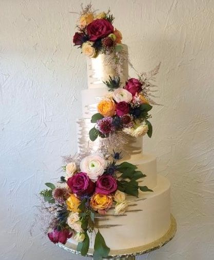 a wedding cake with flowers