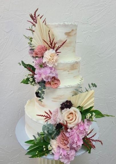 a wedding cake with flowers