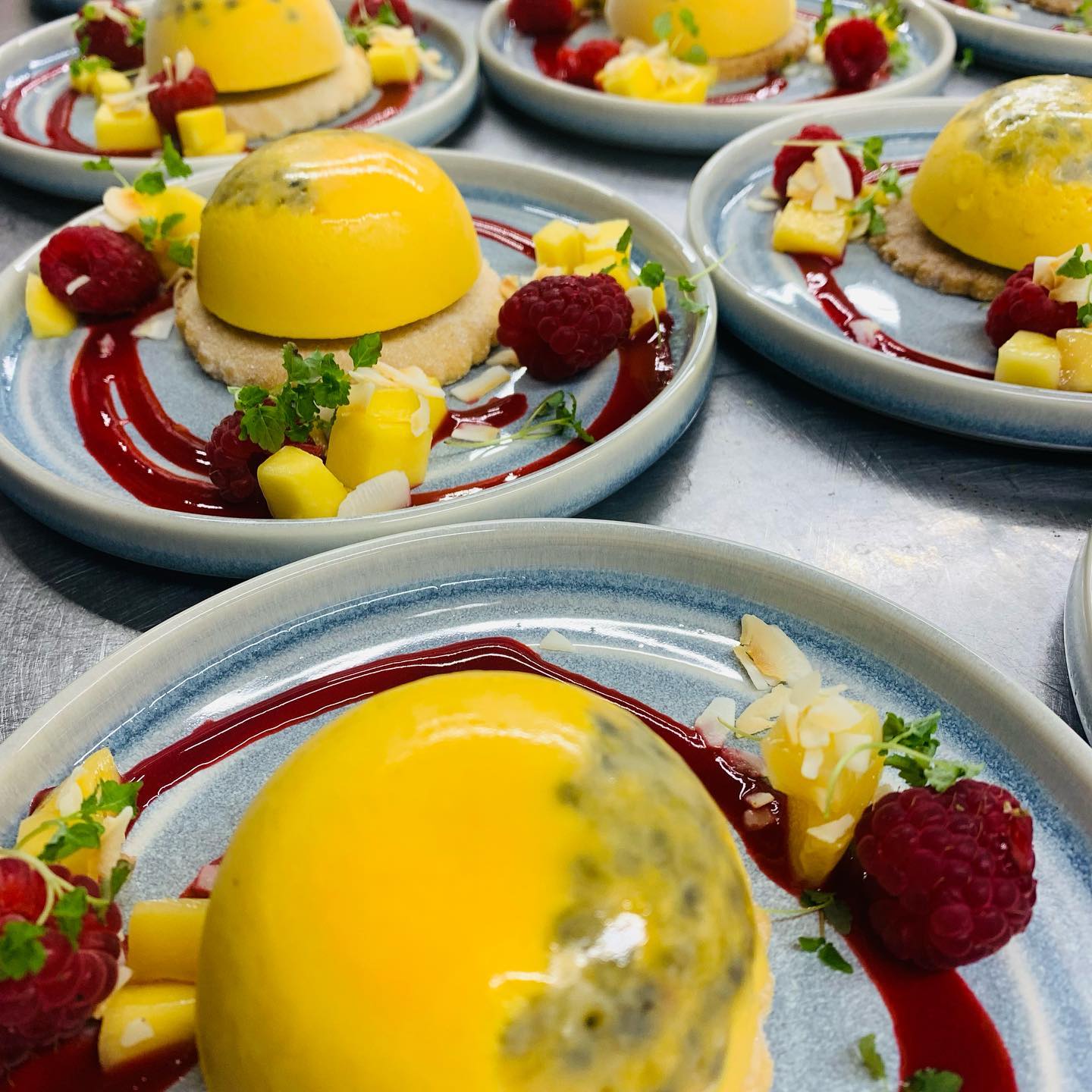 A bunch of plates with desserts on them