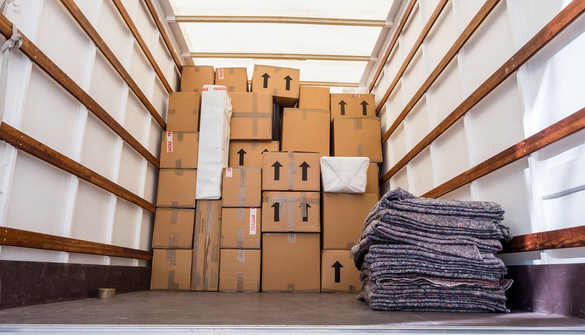 Boxes loaded in a moving truck, ready for transport.