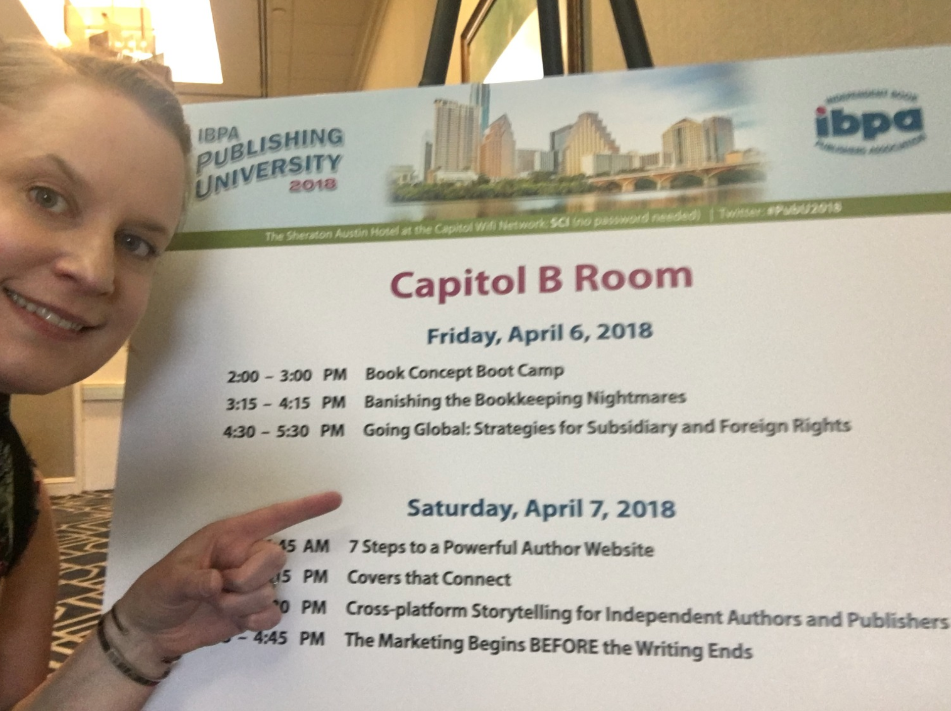 Image of MJ in front of the schedule sign at IBPA