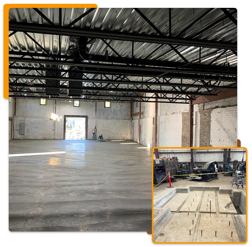 An empty warehouse with concrete floor, exposed beams, and construction work visible on the right.