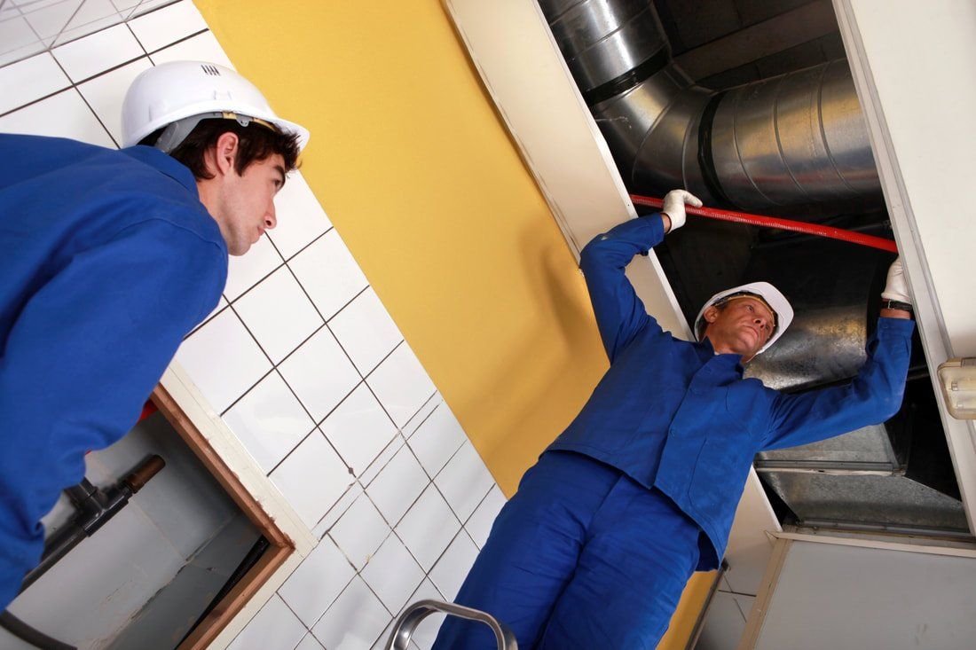 two men sanitizing an air duct system in phoenix, arizona