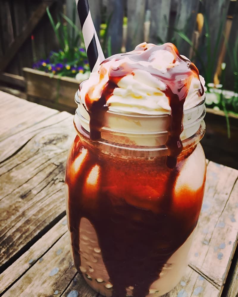 A Milkshake in a Mason Jar With Whipped Cream and Chocolate Sauce — Gold Rush Mini Golf in Warrenheip, VIC