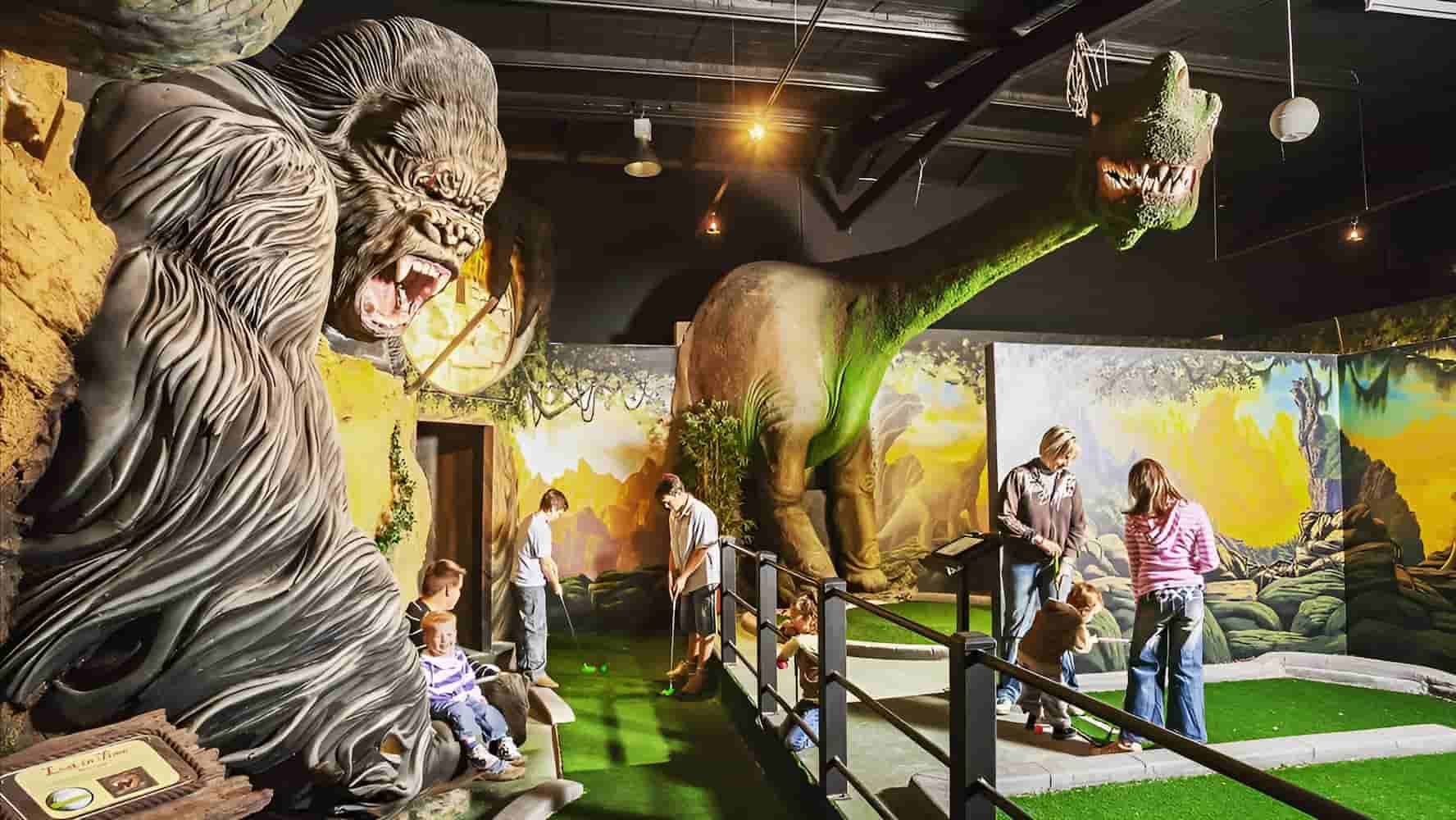 A Group of People Are Standing in Front of a Statue of a Gorilla — Gold Rush Mini Golf in Warrenheip, VIC