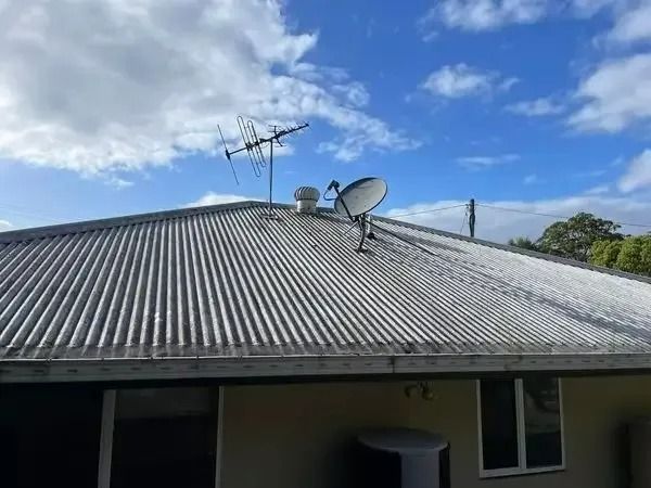 A House With A Satellite Dish On The Roof — Gutter Guard In Lake Cathie, NSW