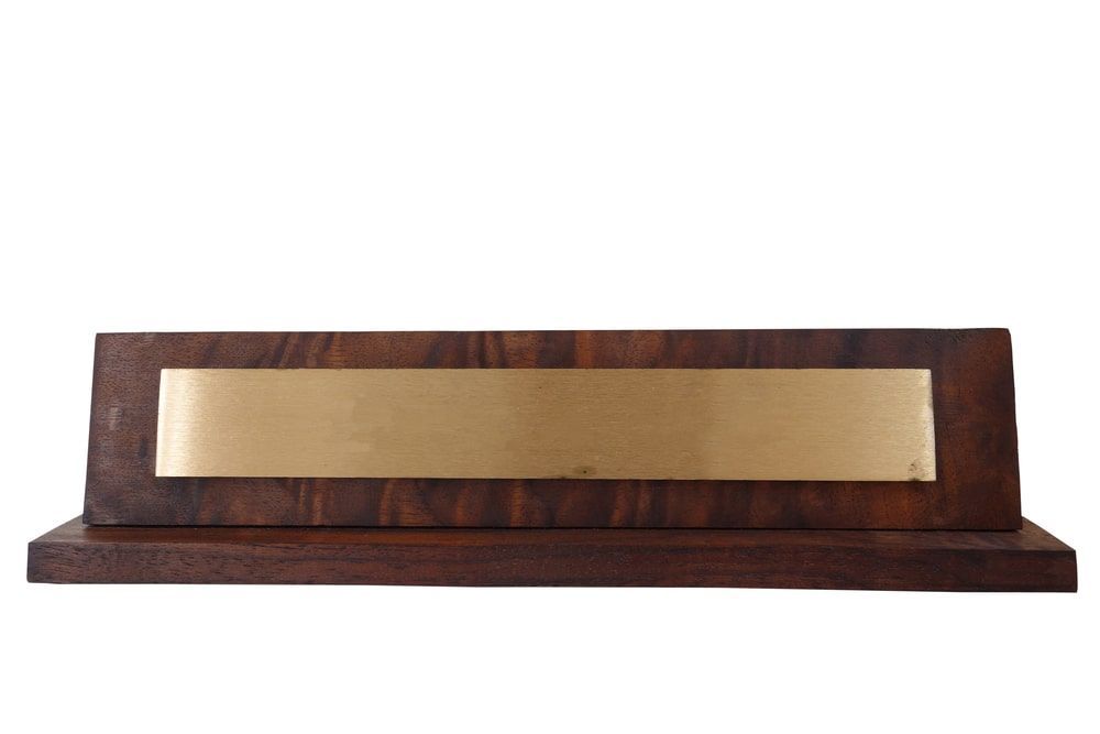 Wooden Name Plate With A Gold Plate On It — Accolades Awards Hunter Valley In Maitland, NSW