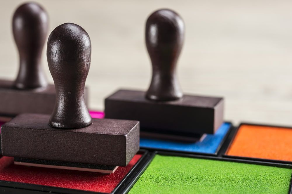 Three Stamps On Top Of A Tray Of Ink Pads — Accolades Awards Hunter Valley In Maitland, NSW