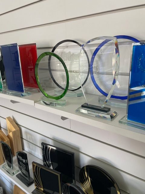 A Set Of Glass Trophies On A Shelf — Accolades Awards Hunter Valley In Maitland, NSW