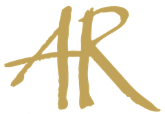 The letter ar is written in gold on a white background