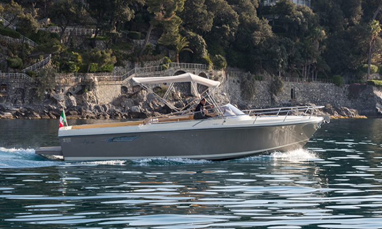 A boat is floating on top of a body of water.