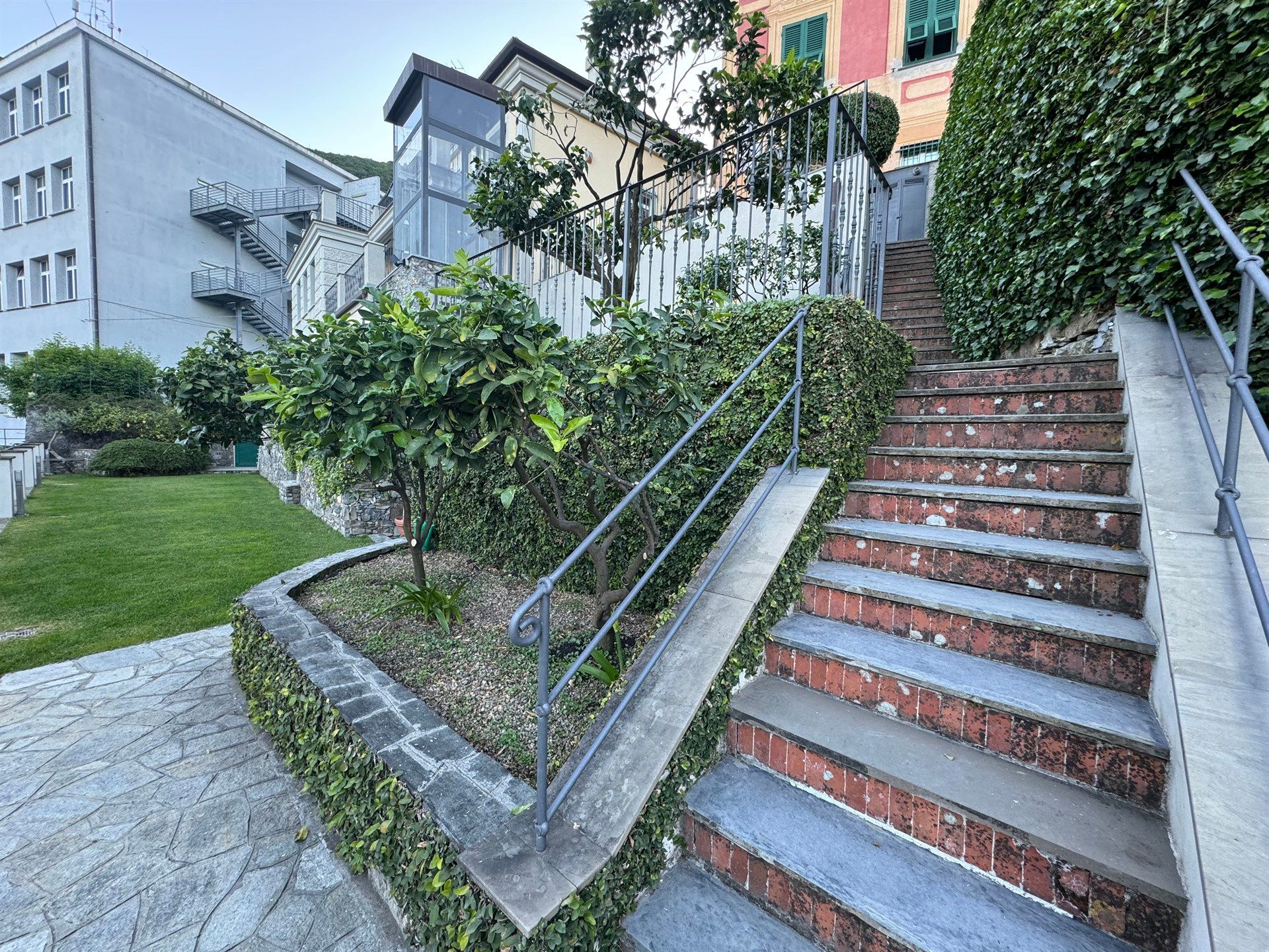 A set of stairs leading up to a building in a park.