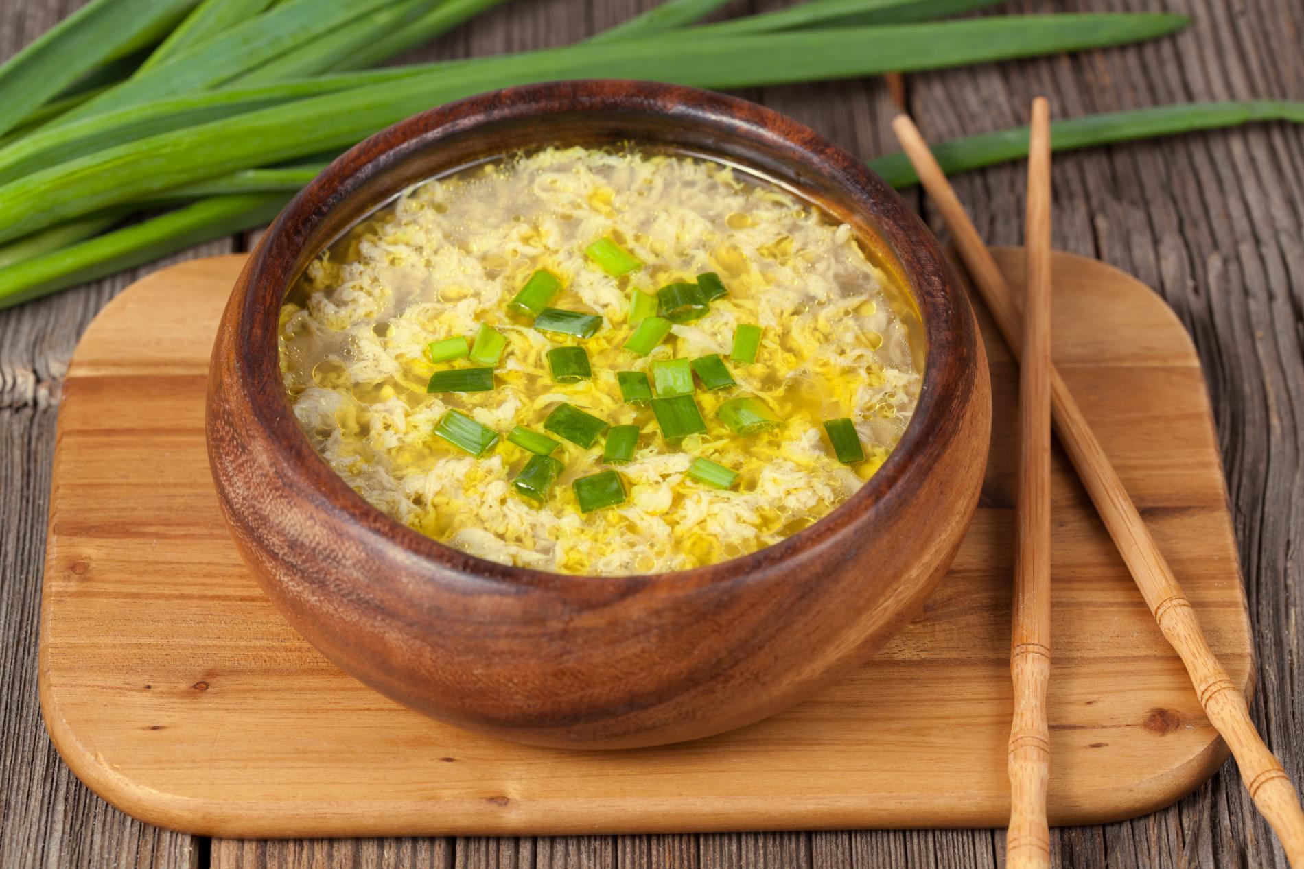 Rice soup in wooden bowl