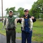 Two Men with Fish on the Road | Auto Smart