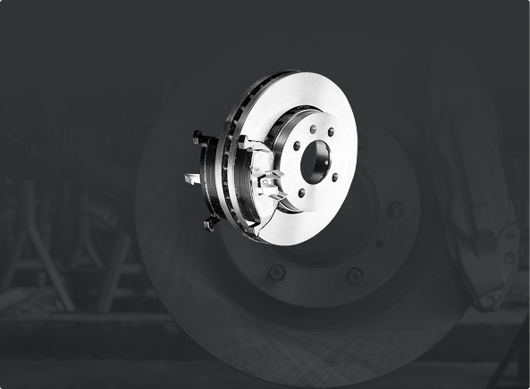 Disc brake assembly on a dark gray background. | Ultimate Car Care