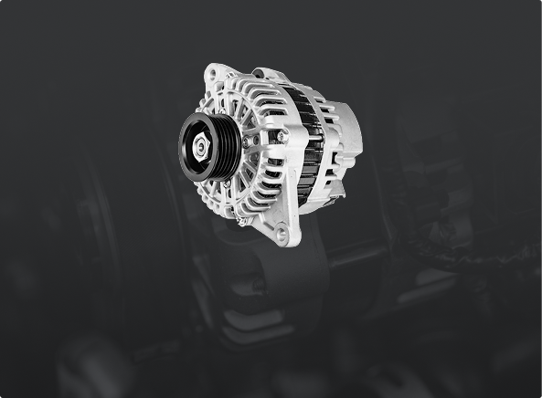 Car alternator, silver with black pulley, on a dark background. | Ultimate Car Care