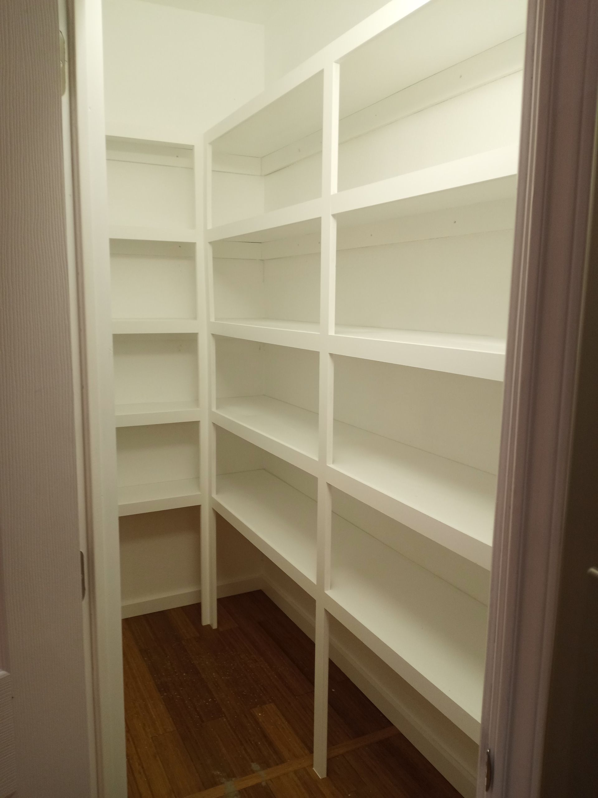 a bathroom with two sinks and two mirrors .