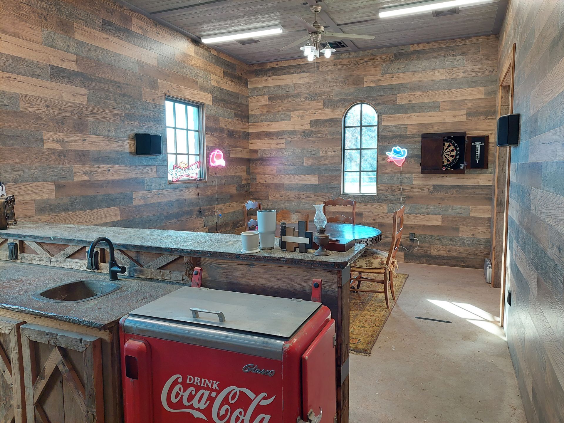 a bathroom with two sinks and two mirrors .
