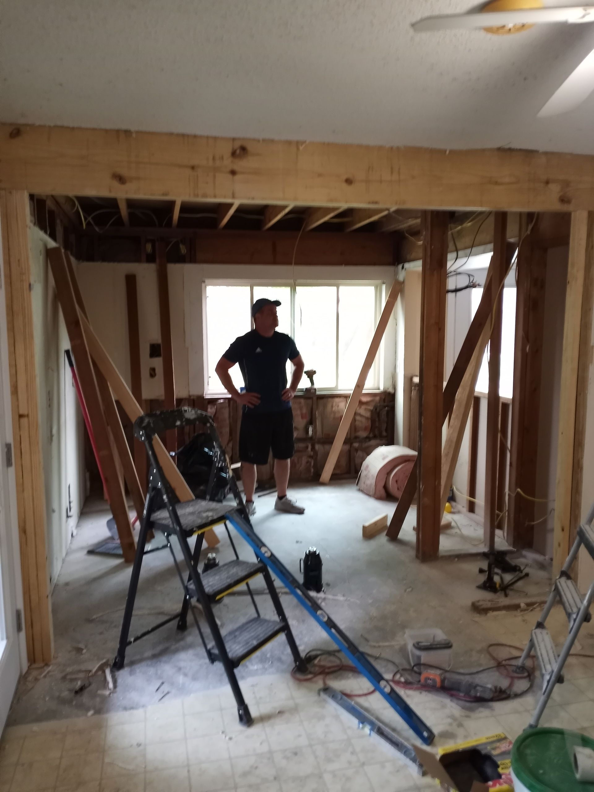 a bathroom with a bathtub , sinks , mirrors and a walk in shower .