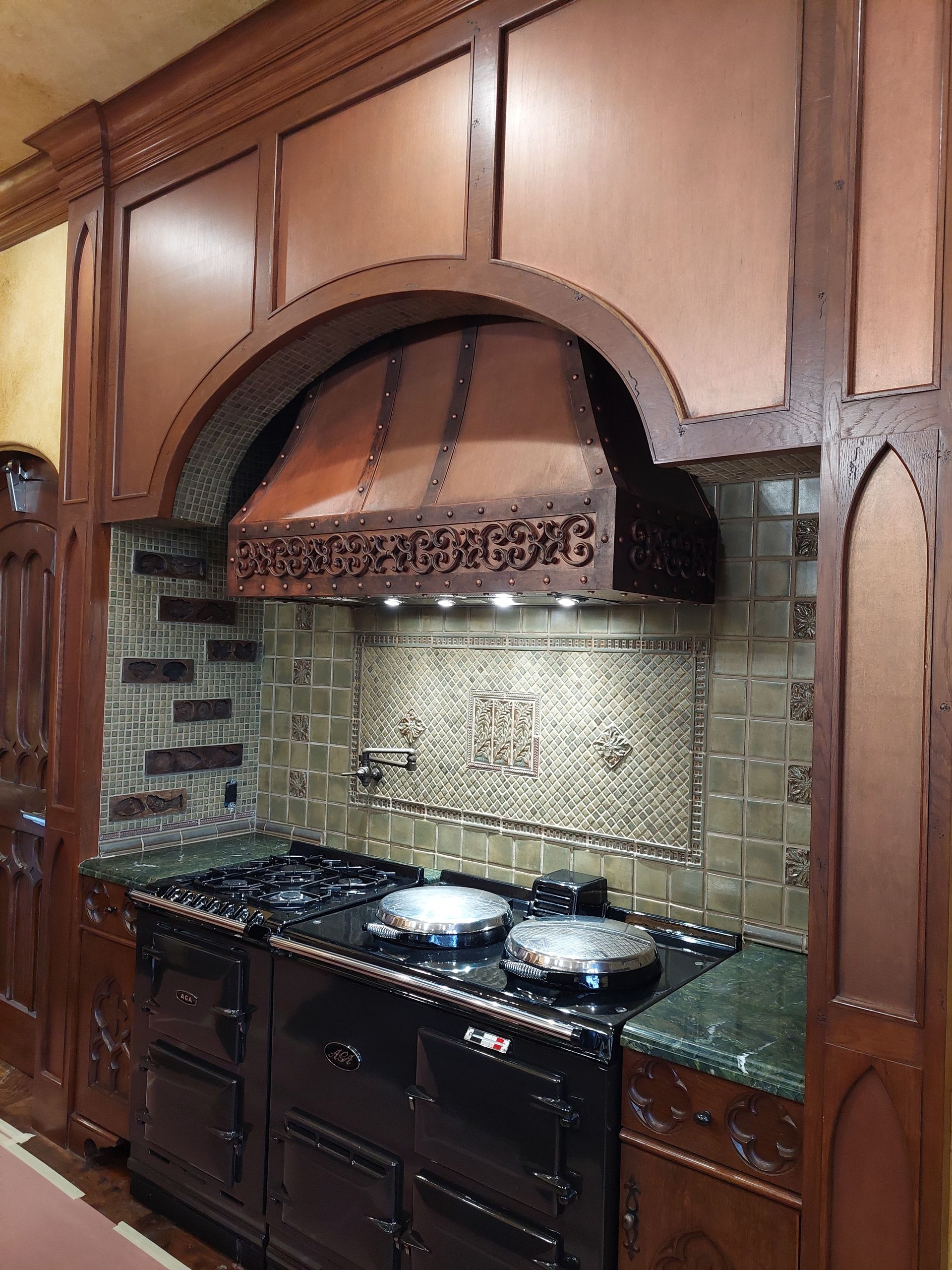 a bathroom with a bathtub and a laptop on a bathtub tray .