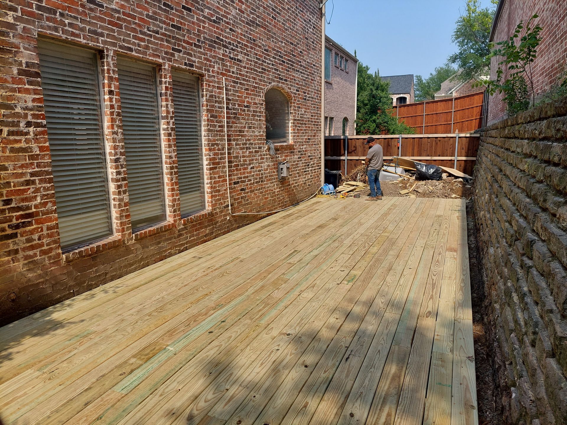 a bathroom with a sink , toilet , mirror and blue walls .
