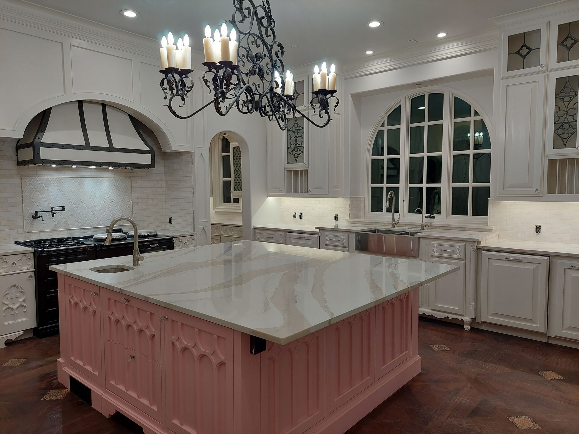 a bathroom with two sinks , two mirrors and a walk in shower .