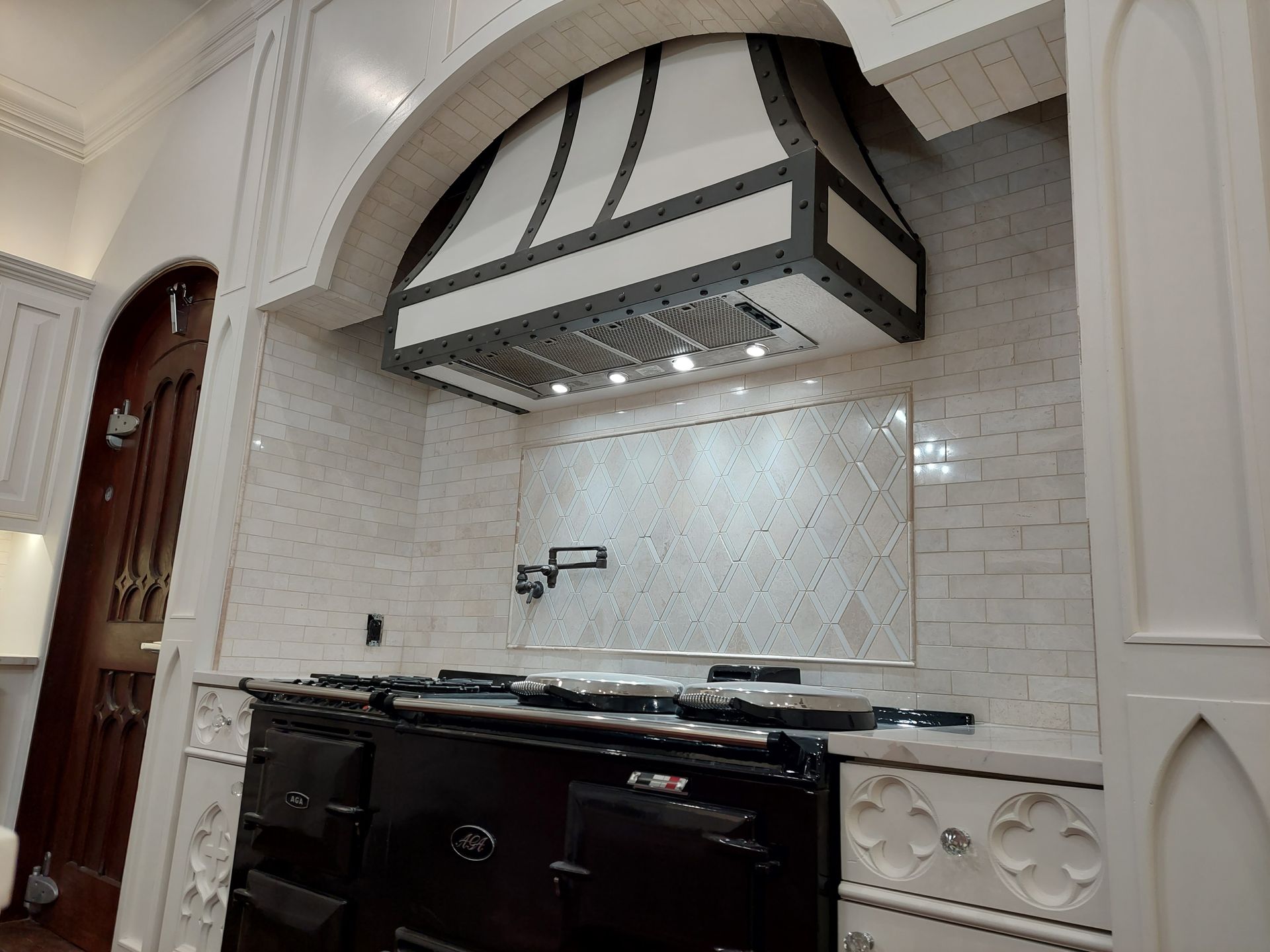a bathroom with a bathtub , sink , shower and mirror .
