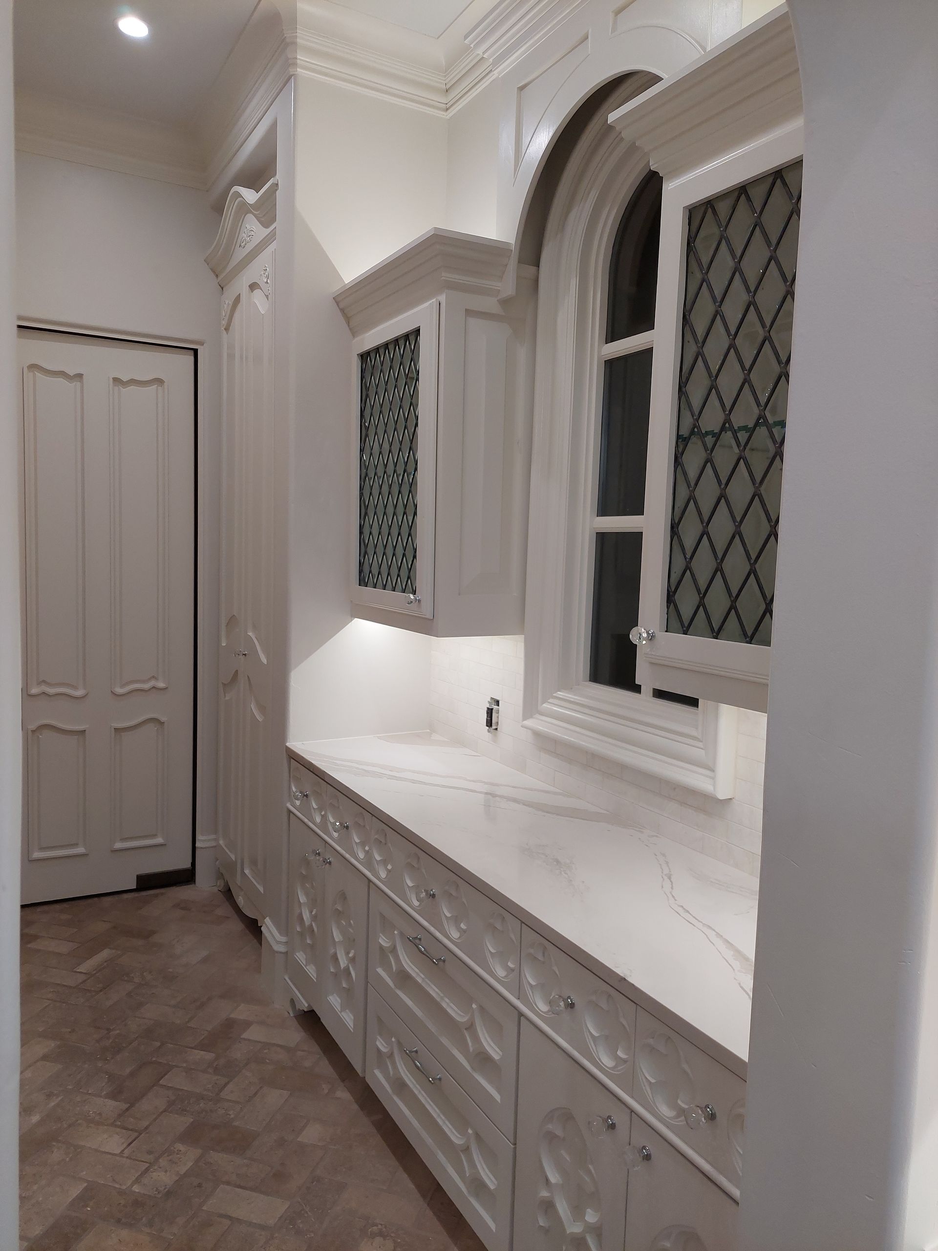 a bathroom with a tub , shower , and marble tiles .