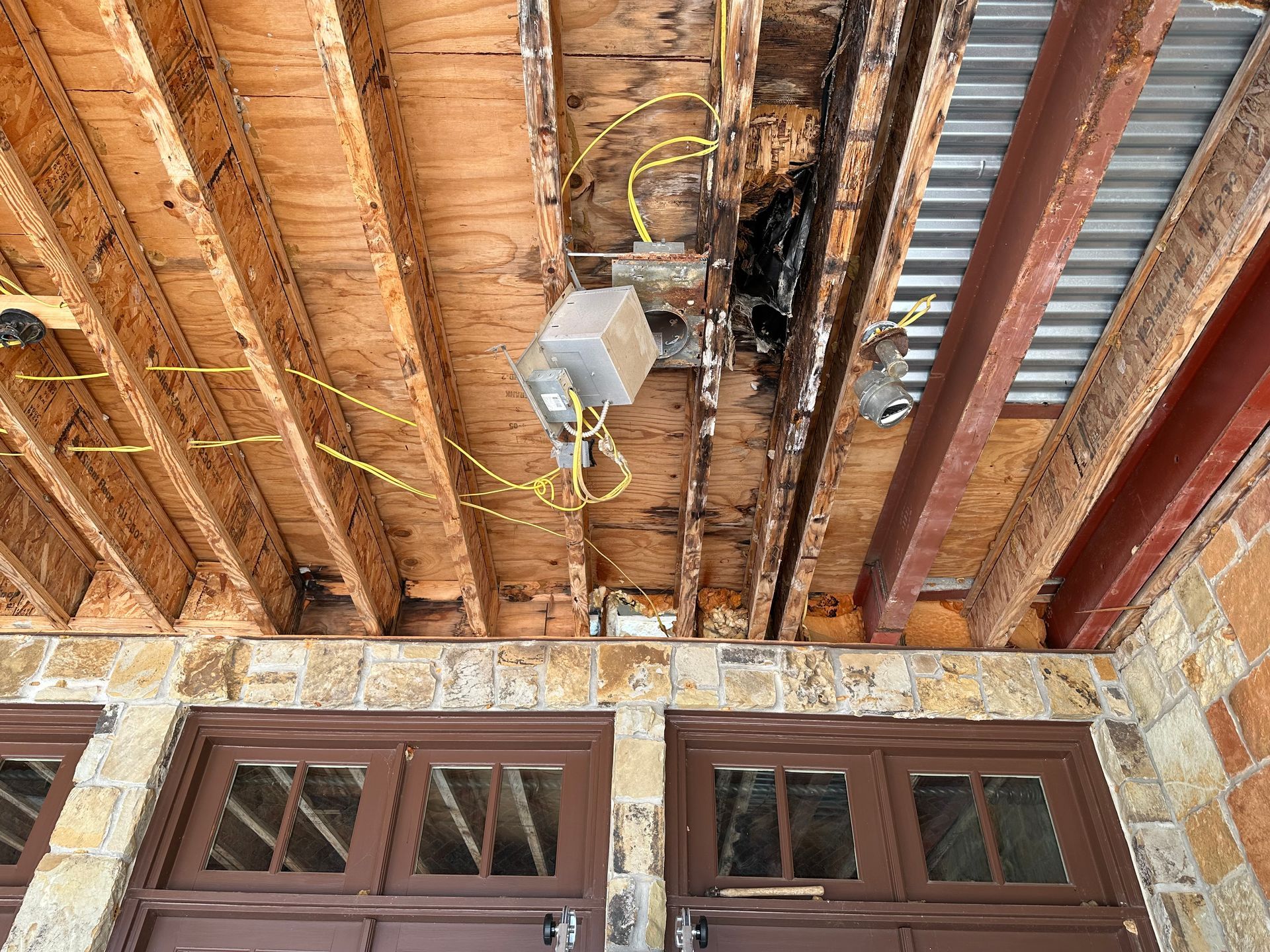 the ceiling of a garage is being remodeled .