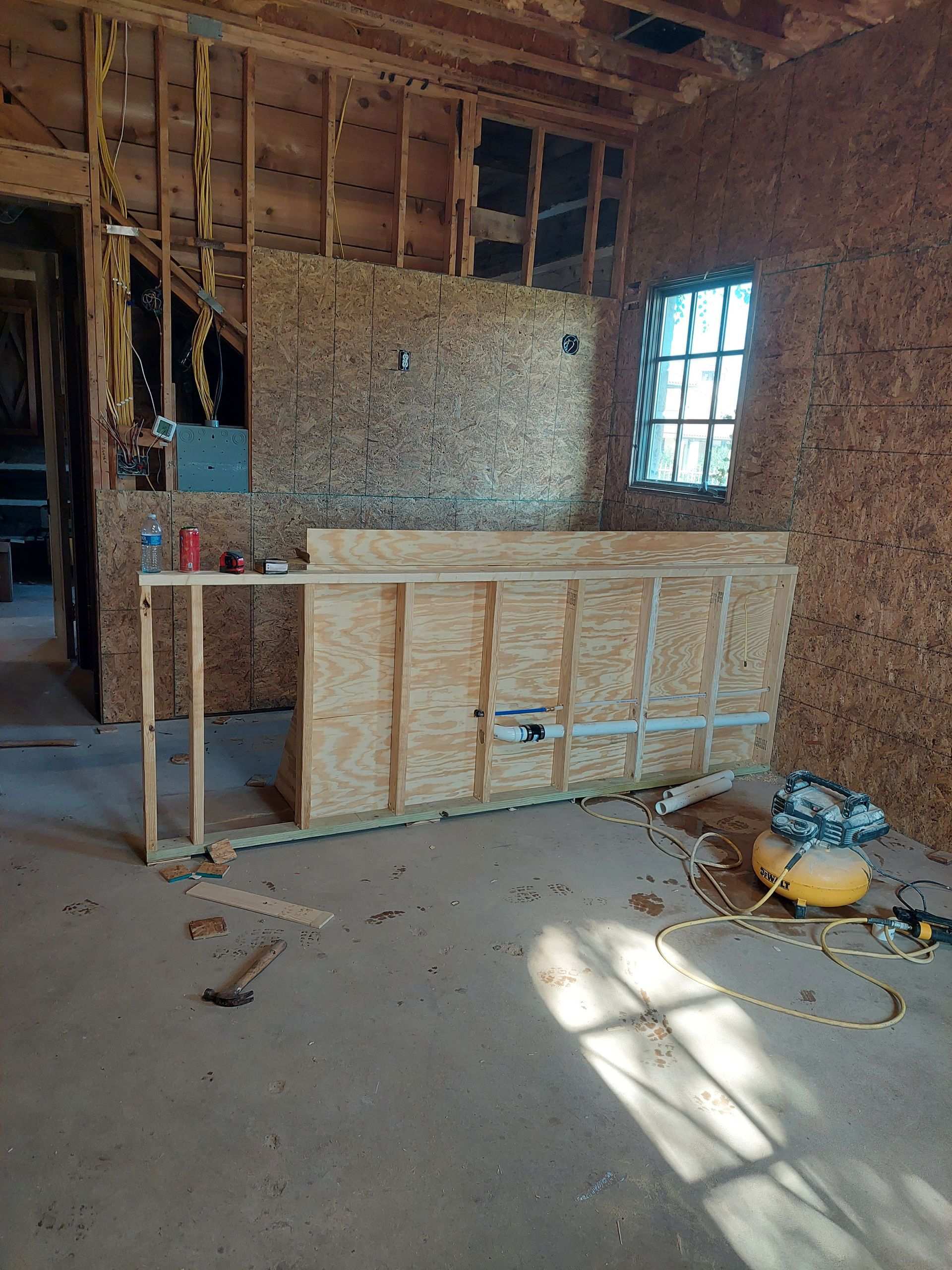 a bathroom with a walk in shower and a sink .