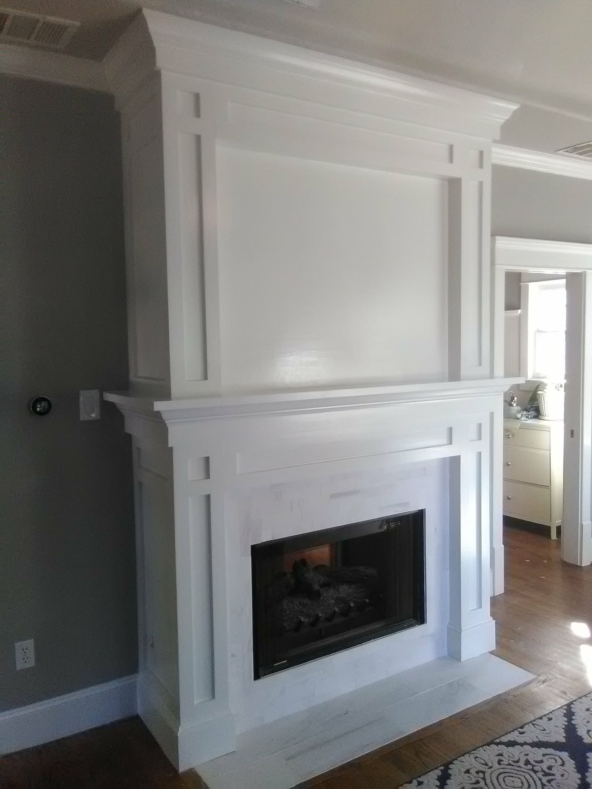 a bathroom with a black tub and a walk in shower .