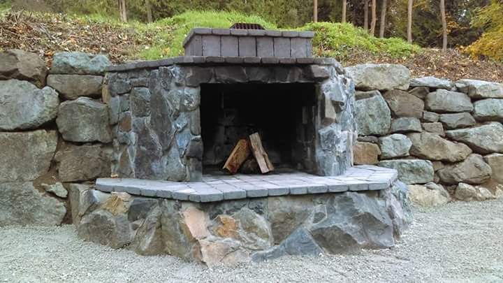 a bathroom with a walk in shower with a glass door .