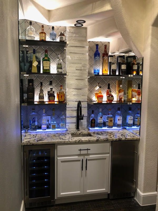 a bathroom with a sliding glass shower door and a toilet