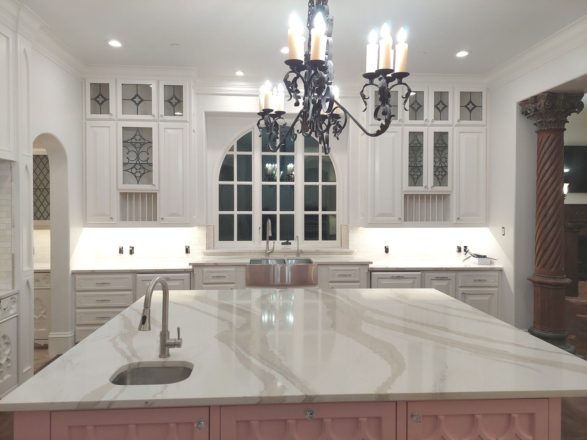a bathroom with a walk in shower and a sink .